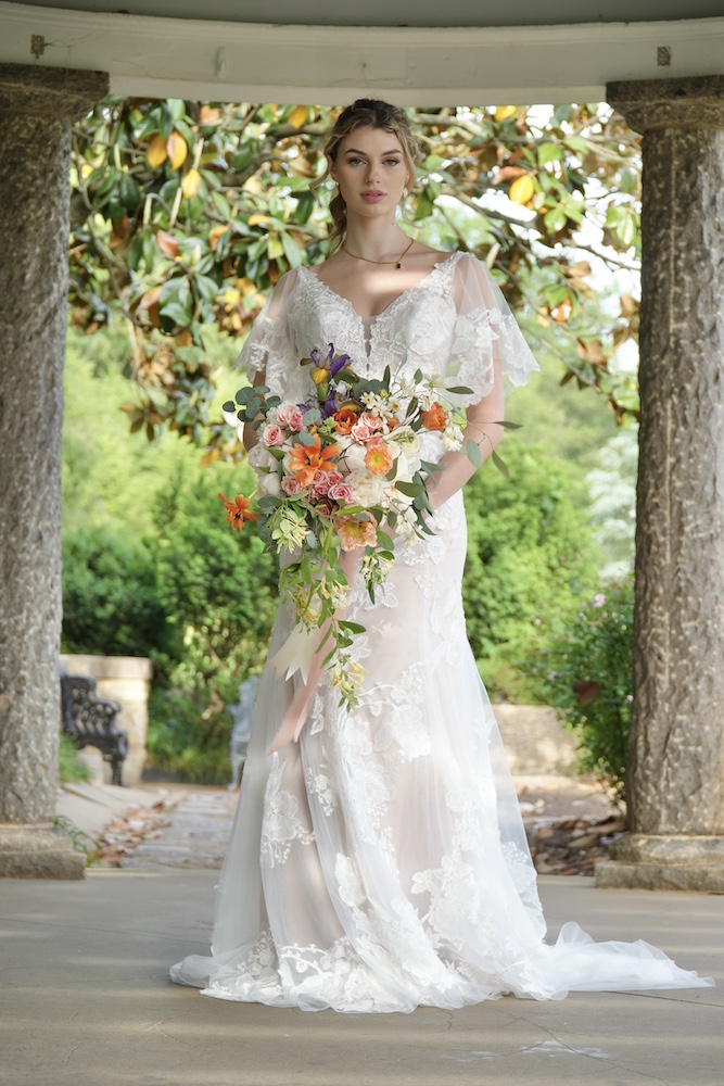 BBride holding cascading bouquet by Virginia wedding florist 